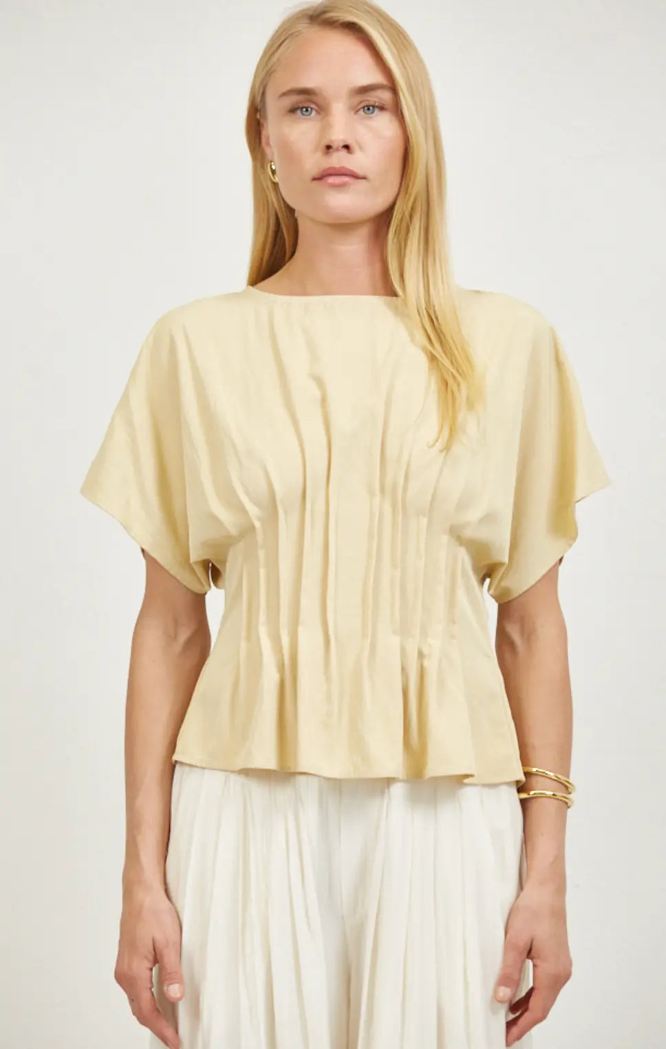 A.ren Leah Top in extra small, stylish women's apparel with a fitted design and soft fabric, shown on a neutral background.