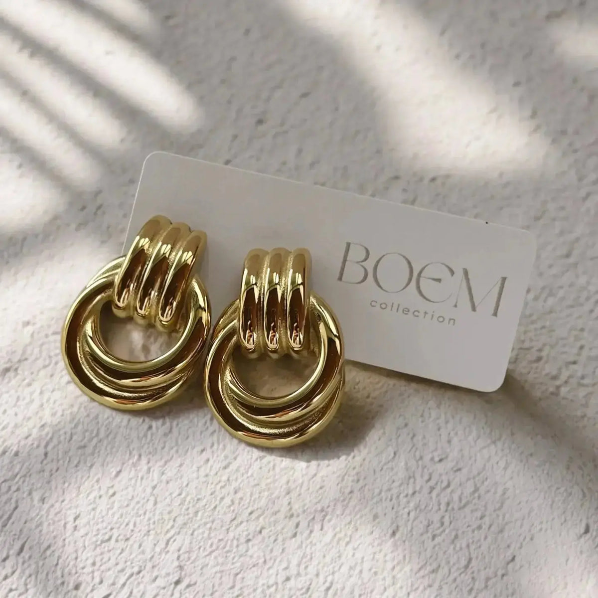 Boem Etta Earrings jewelry featuring elegant silver hoops with intricate design and polished finish.