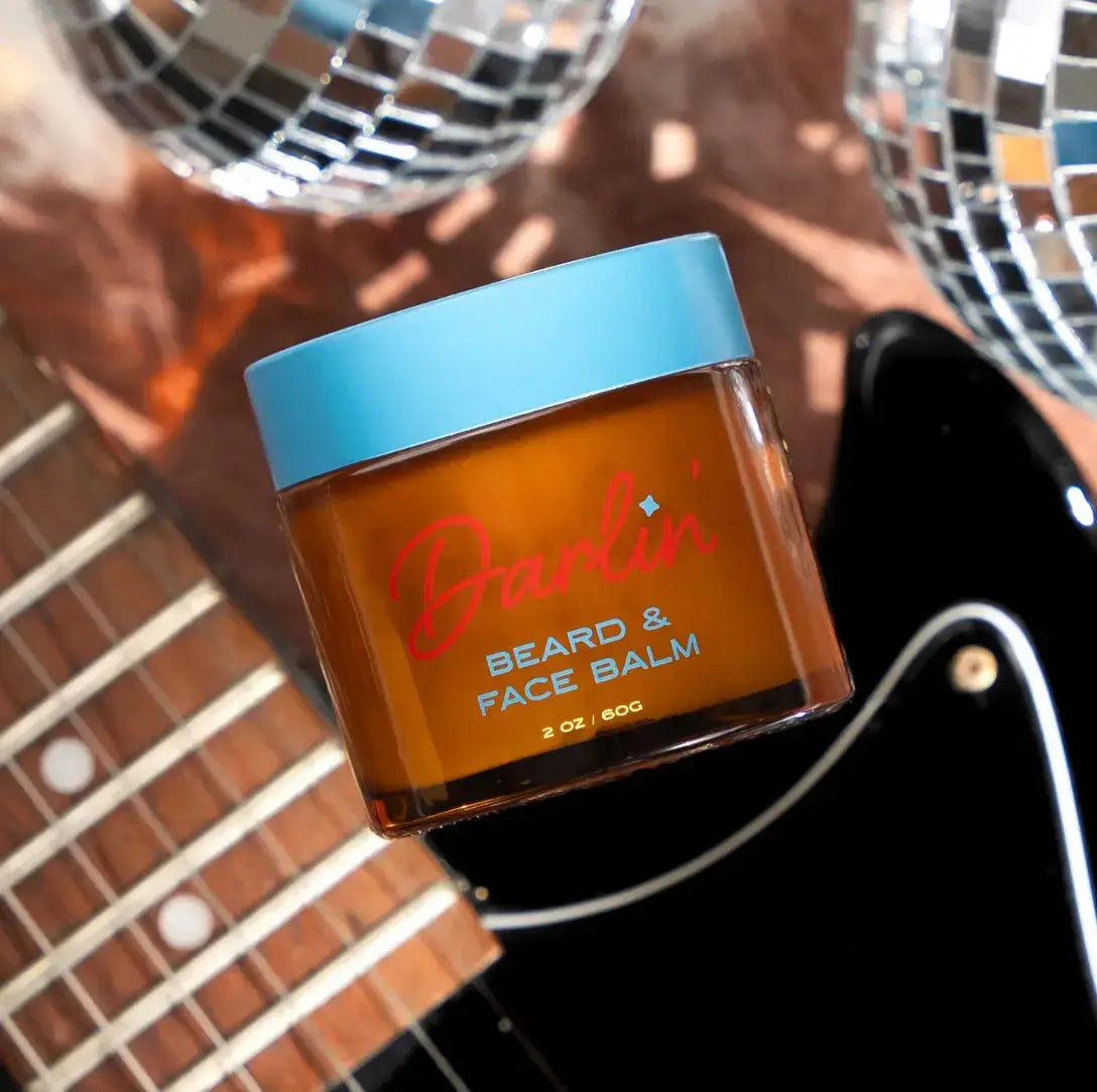 Darlin Skincare beard and face balm jar showing the natural balm inside with a clean, minimalist label design.
