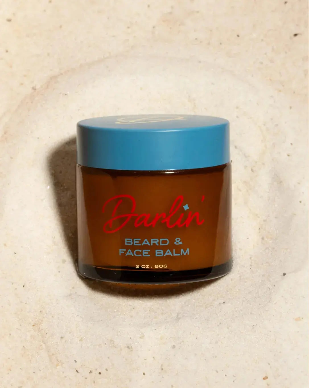 Darlin Skincare beard and face balm jar with label, showing the natural moisturizing product for facial hair and skin care.