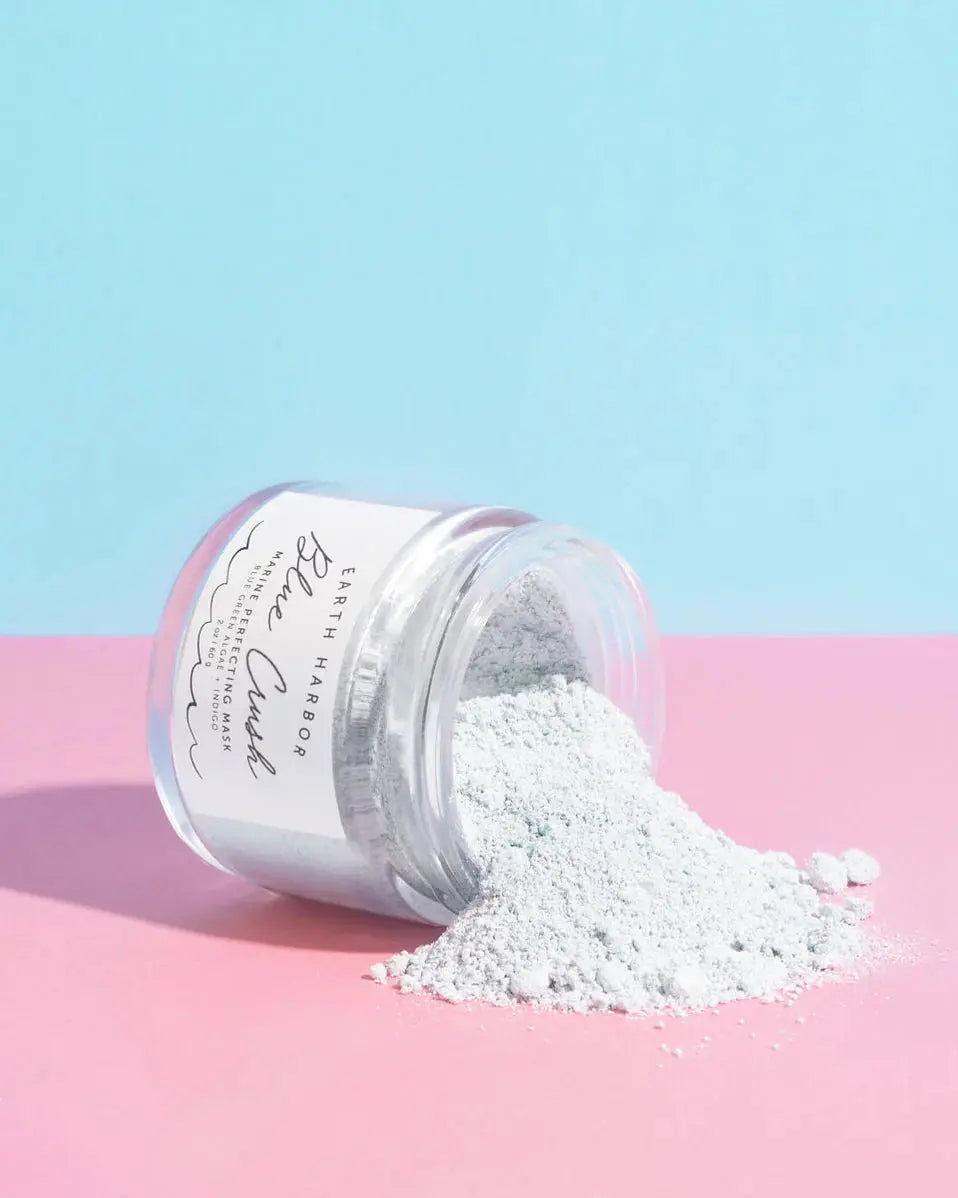 Earth Harbor Blue Crush Marine Perfecting Mask in a blue jar, featuring a smooth, creamy texture and marine-inspired ingredients.