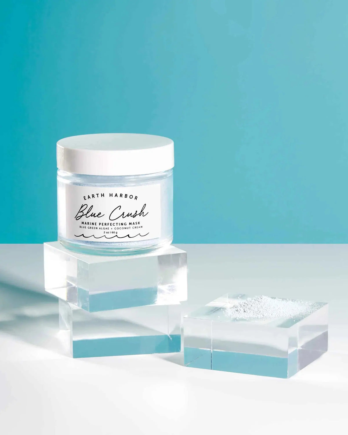 Blue Crush Marine Perfecting Mask by Earth Harbor, creamy blue facial mask with marine ingredients in a sleek jar.
