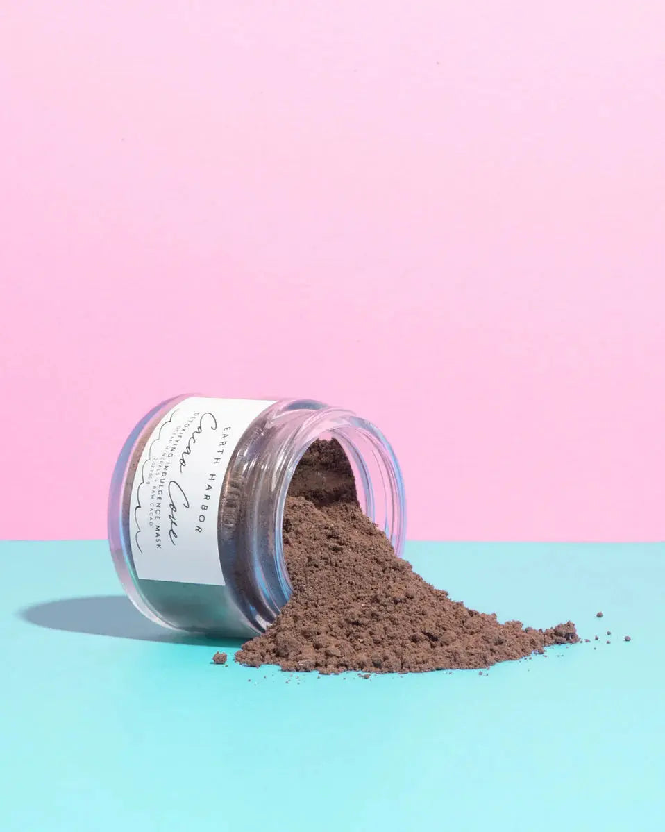 Earth Harbor Cacao Cove Detoxifying Vitamin C Mask applied on clean skin, featuring rich chocolate-brown color and creamy texture.