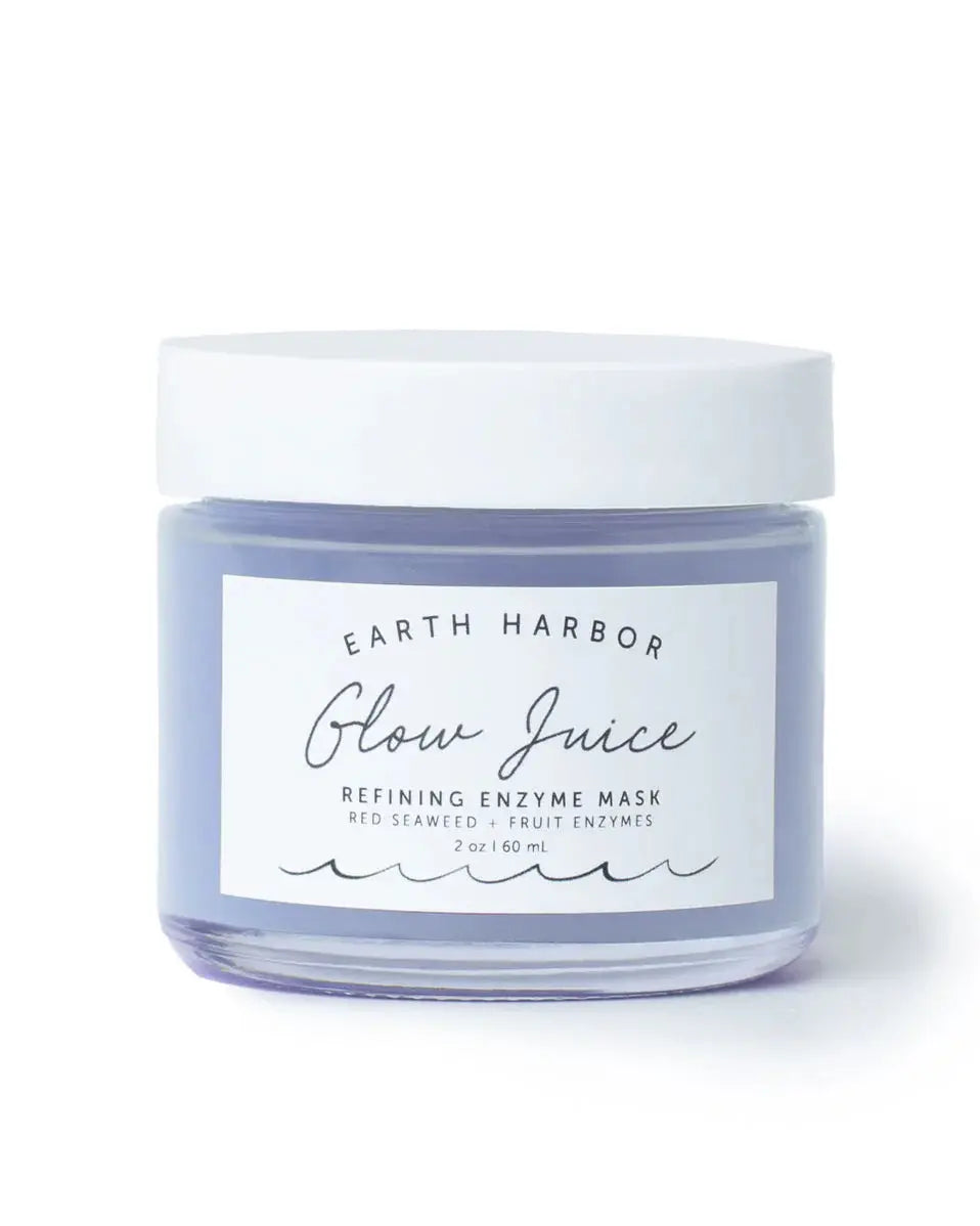 Earth Harbor Glow Juice Refining Enzyme Mask in a sleek jar with a creamy texture and natural ingredients visible.