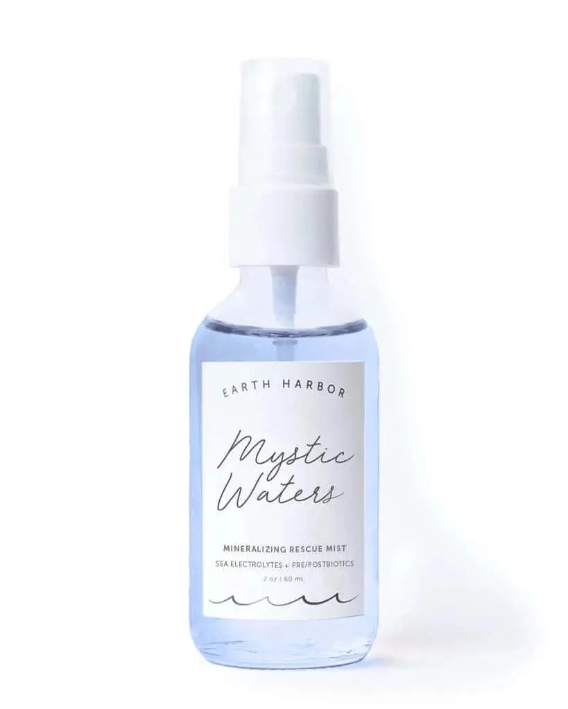 Earth Harbor Mystic Waters Mineralizing Rescue Mist in a spray bottle, designed to hydrate and revitalize skin with mineral-rich formula.