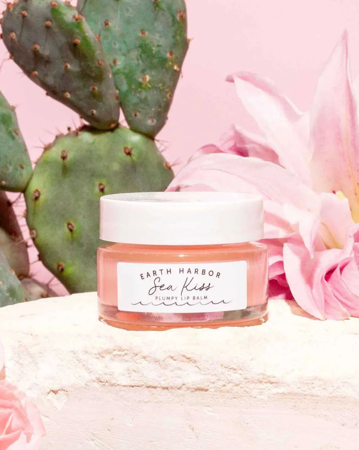 Earth Harbor Sea Kiss Plumpy Lip Balm with natural ingredients in a sleek tube, designed to nourish and hydrate lips.