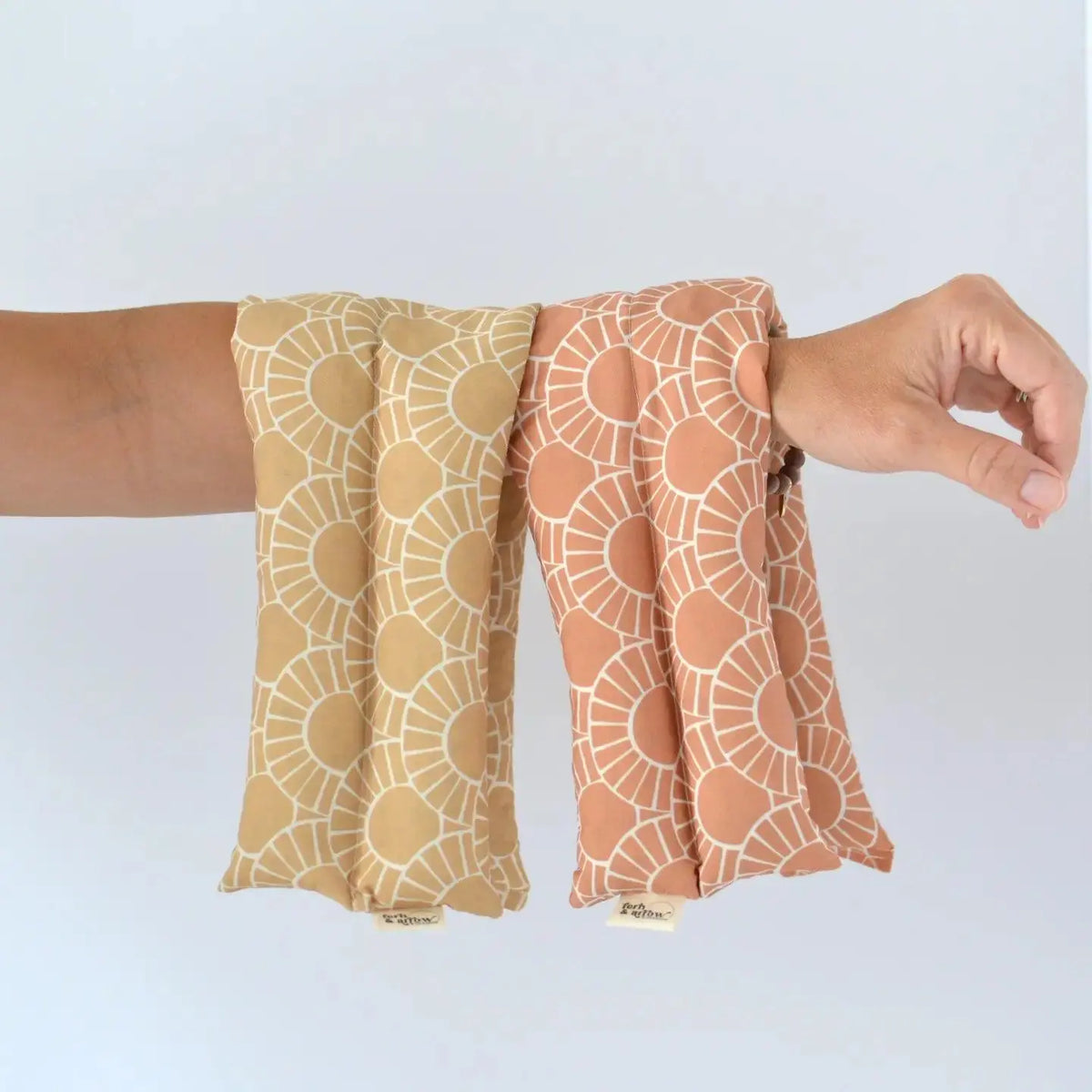 Fern and Arrow aromatherapy neck wrap with Juliette stripe design, soft fabric for soothing personal use.