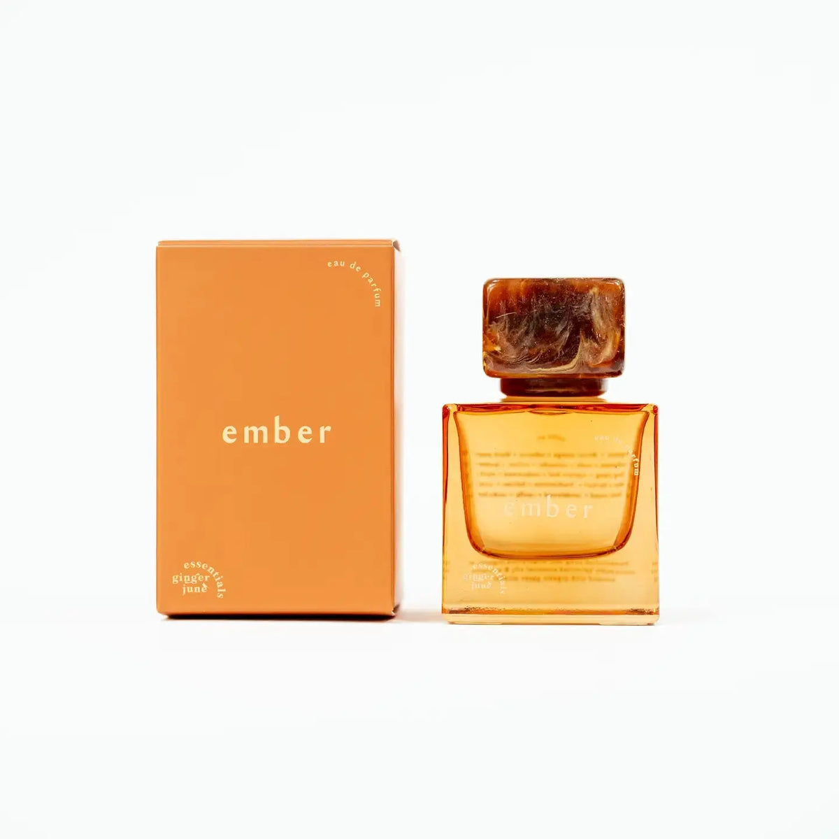 Ginger June Ember essential oil perfume bottle with elegant packaging, showcasing a luxurious fragrance product.