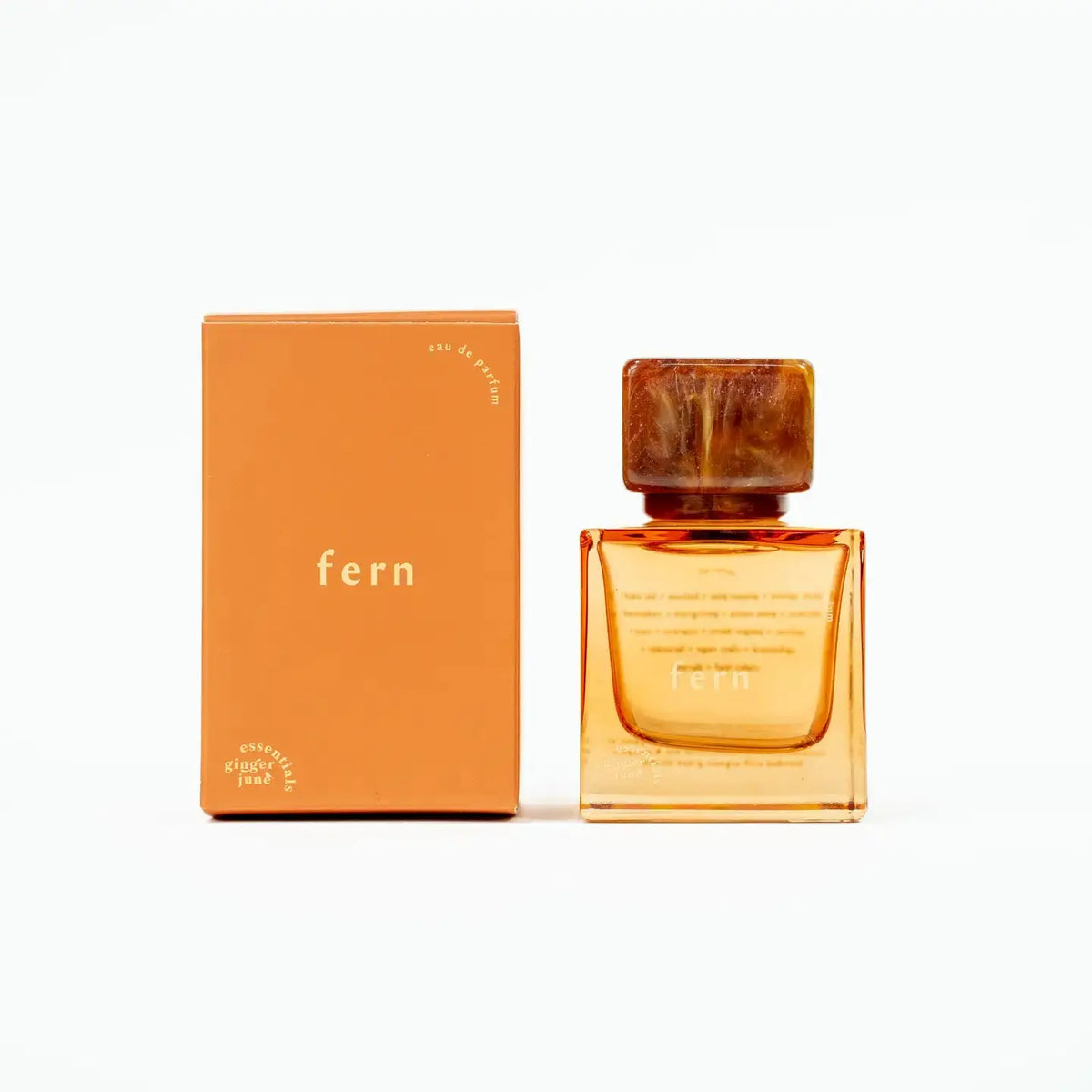 Ginger June Fern Essential Oil Perfume roll-on bottle with natural botanical design and label visible.
