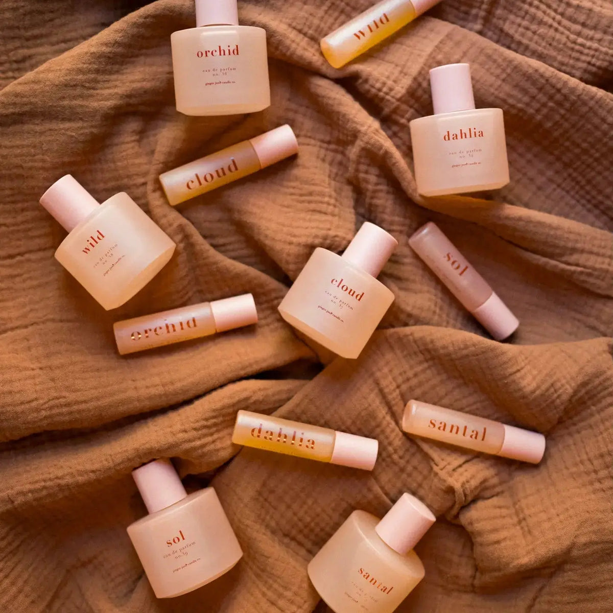 Ginger June honey essential oil perfume roll-on with a clear glass bottle and gold cap, showcasing a natural, fragrant scent.