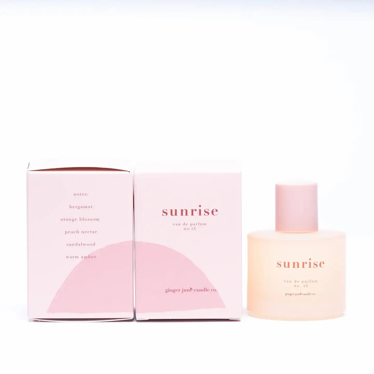 Ginger June Sunrise Perfume roller bottle, floral and citrus scent, with a sleek design and bright sunrise-inspired label.