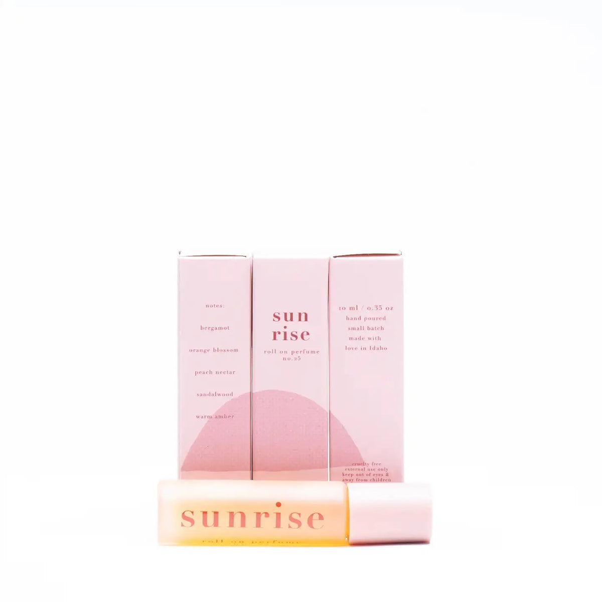 Ginger June Sunrise Perfume in a rollerball bottle, featuring a bright, floral fragrance with warm citrus notes.