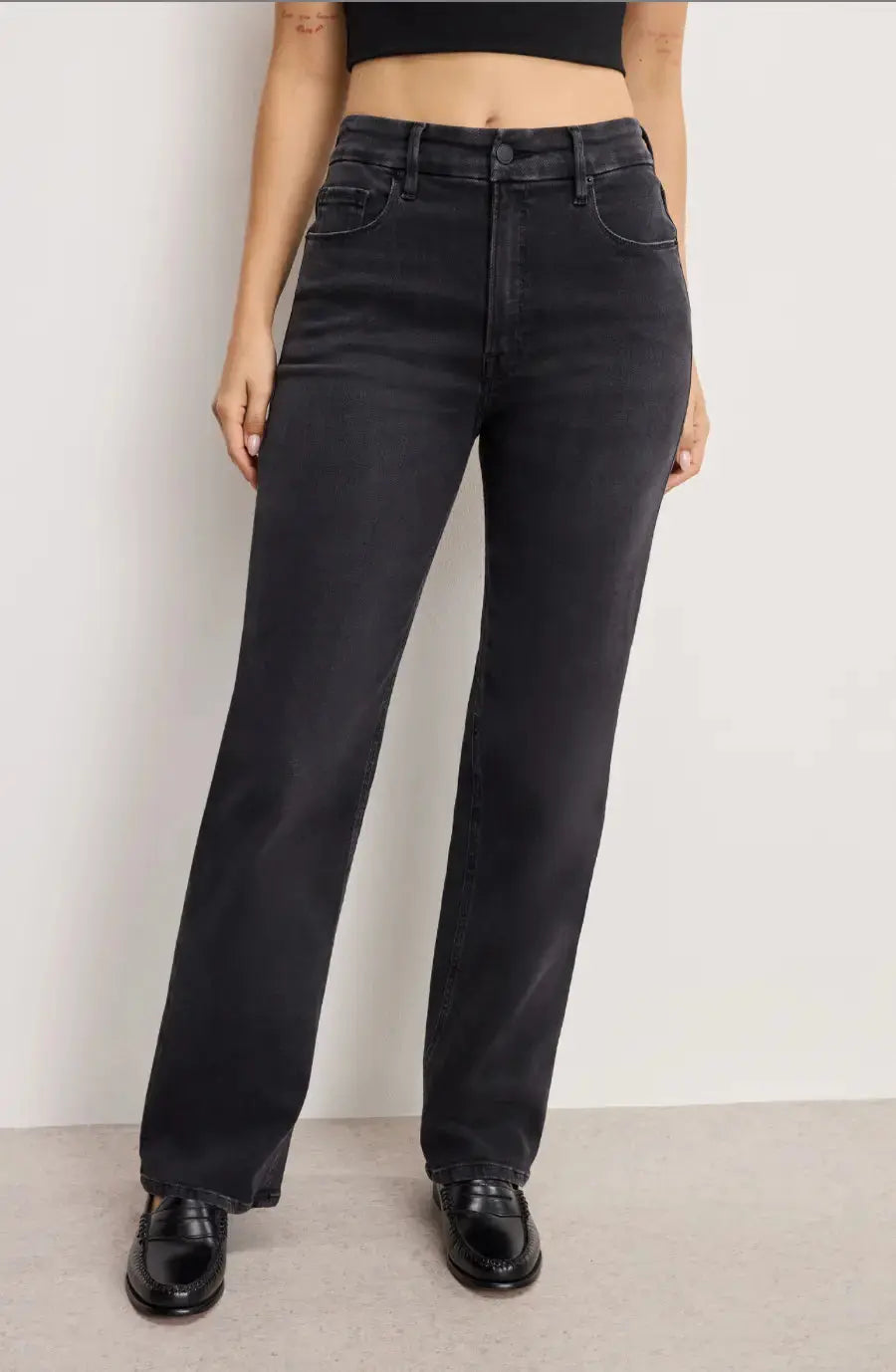 Good American True Straight apparel, showing fitted denim jeans with a classic straight-leg design and visible stitching.