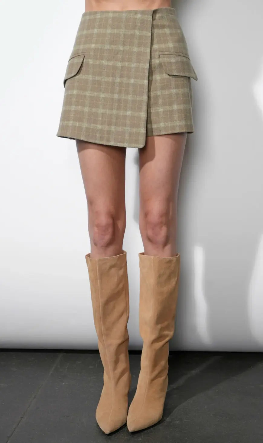 Gray and white plaid Greylin Aria wrap skort featuring a stylish wrap design and comfortable fit.