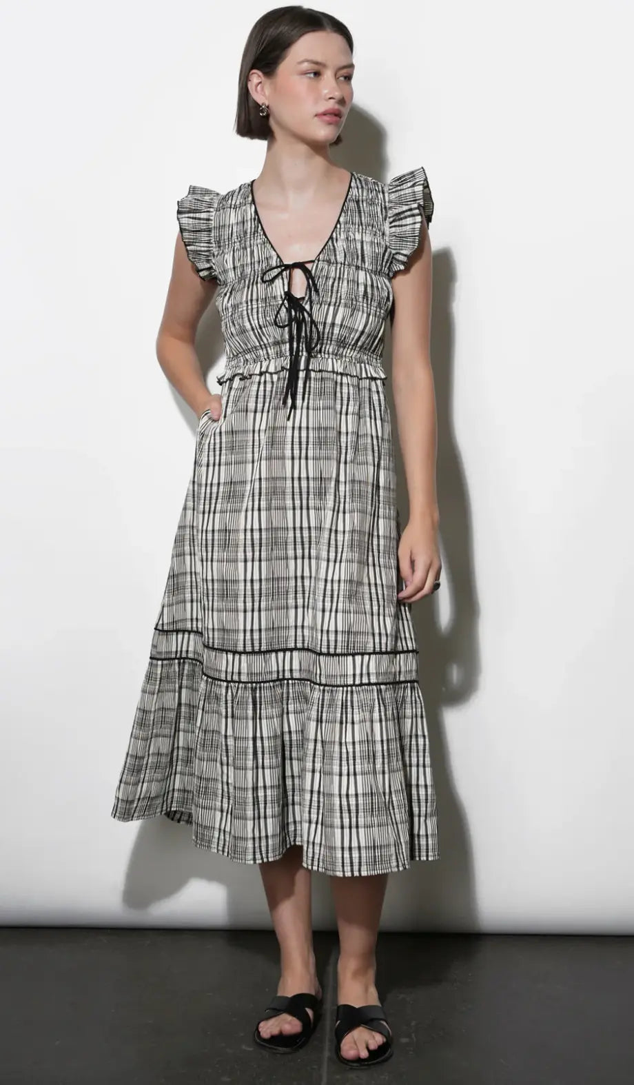Greylin Eloise tie-front midi dress showing a stylish, flowy apparel dress with a tie-front detail and midi length.