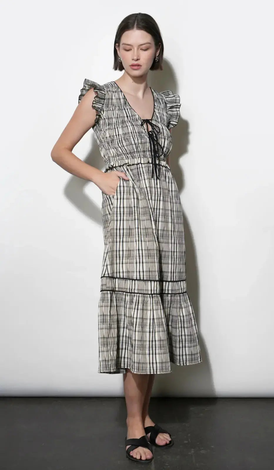 Greylin Eloise tie-front midi dress featuring a fitted bodice, midi length, and stylish front tie for a chic, feminine look.