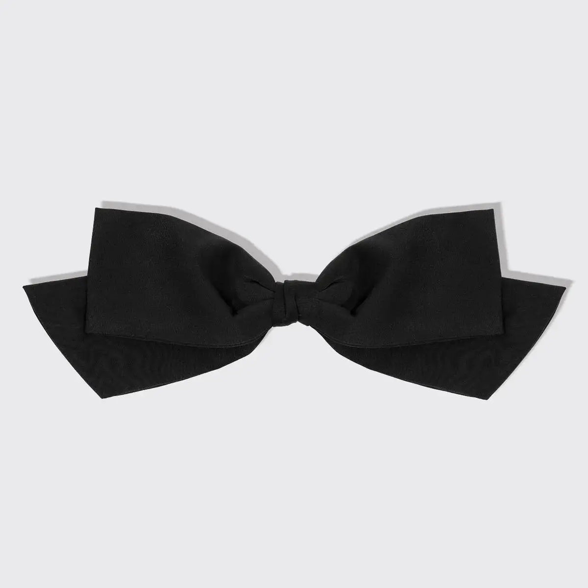 Fabric bow hair clip from hair hair accessories, featuring a soft, stylish fabric bow for hair styling.