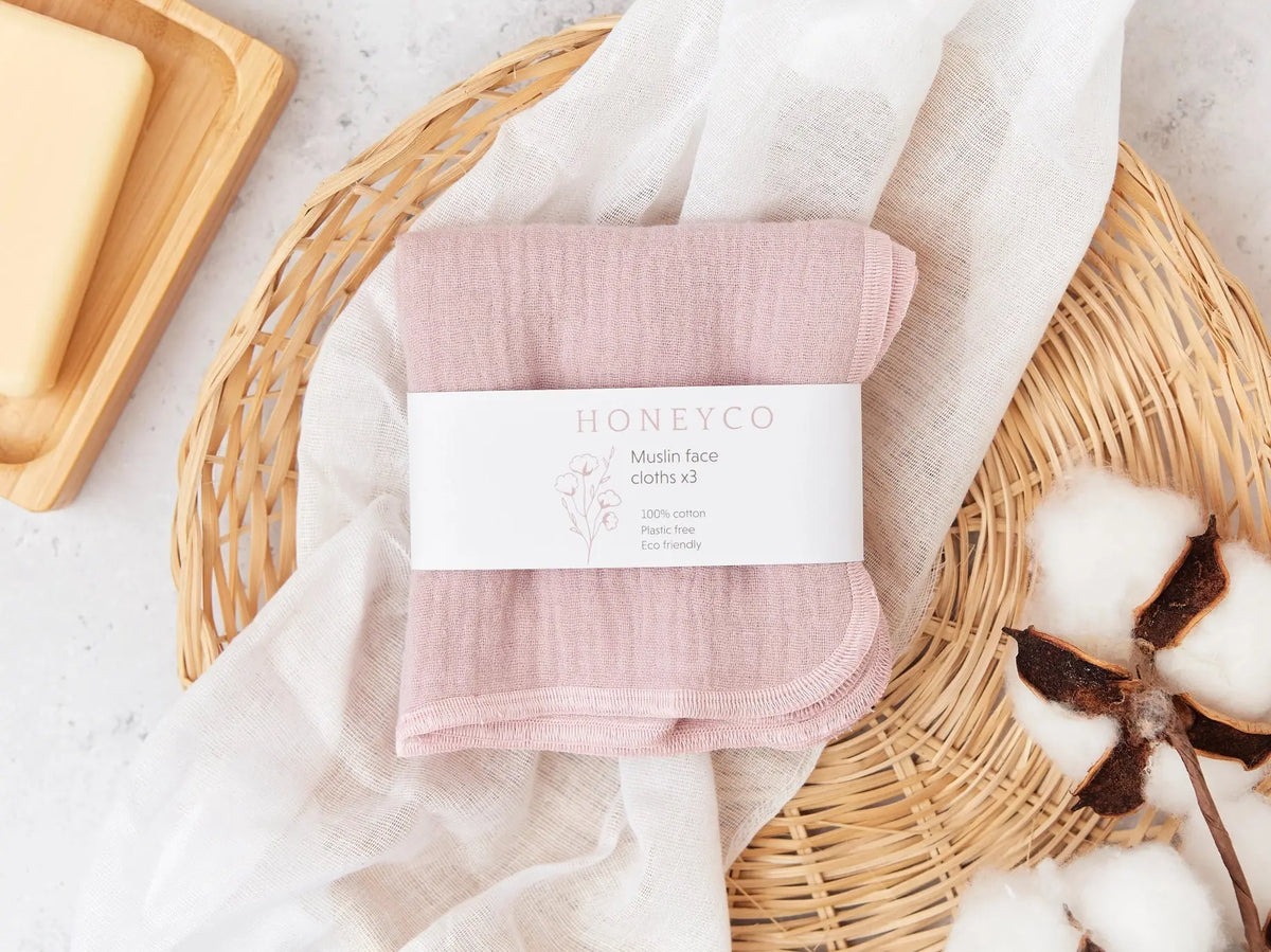 Set of green HoneyCo reusable muslin face cloths, soft and eco-friendly for gentle facial cleansing.