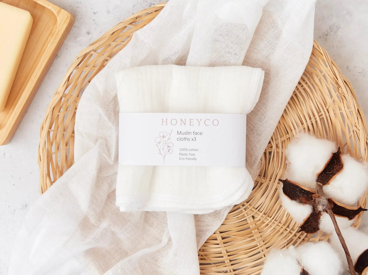 Set of green HoneyCo muslin reusable face cloths, soft and breathable for gentle facial cleansing and skincare.