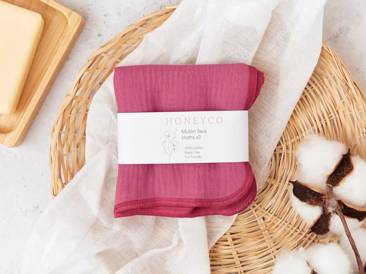 Set of green HoneyCo muslin reusable face cloths, soft and breathable for gentle skincare and cleansing.