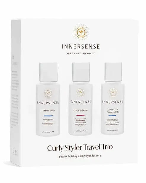 Innersense Organic Beauty Curly Styler Travel Trio with curl-enhancing products in travel-sized bottles on a white background.