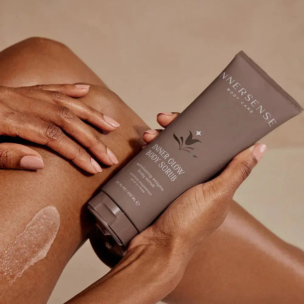Innersense Organic Beauty Inner Glow Body Scrub in a jar, showing exfoliating texture and natural ingredients for smooth skin