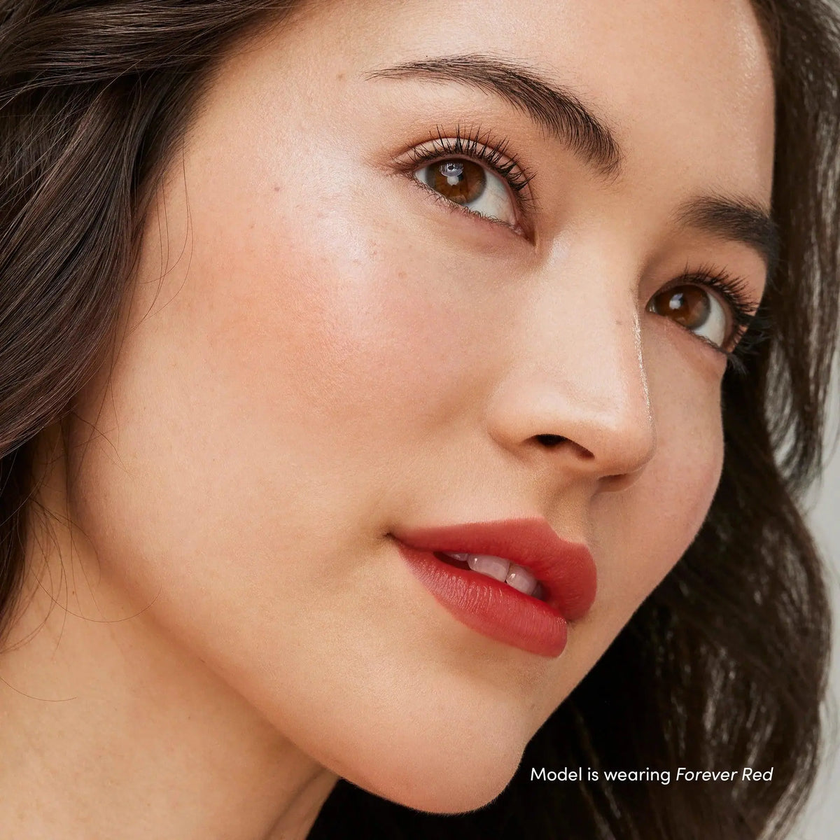 Jane Iredale Just Kissed Lip and Cheek Stain in Forever Pink, a versatile lip balm and cheek tint with a smooth, natural finish.