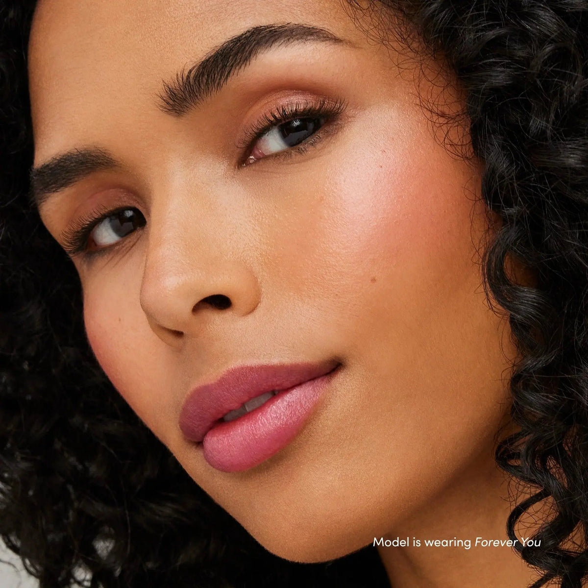 Jane Iredale Just Kissed Lip and Cheek Stain in Forever Pink, a versatile lip balm and cheek tint with a smooth, natural finish.