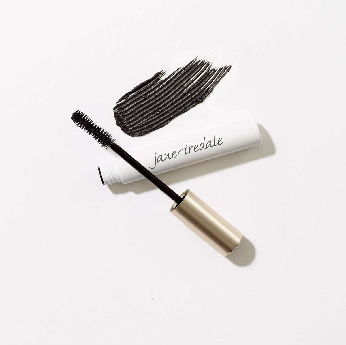 Jane Iredale Beyond Lash™ Volumizing Mascara in black, displaying a sleek tube with a mascara wand for bold, volumized lashes.