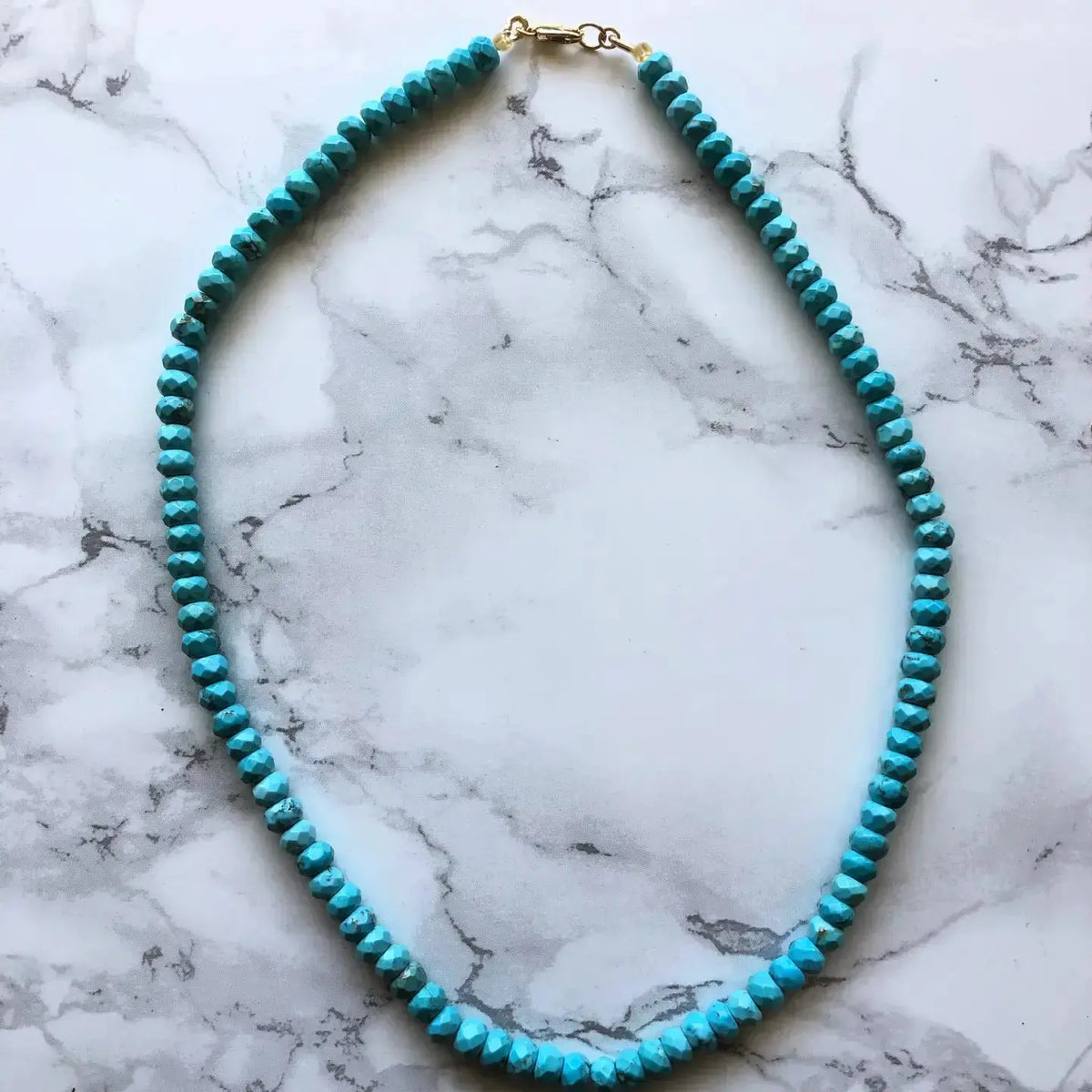 Turquoise necklace by Jessica Matrasko Jewelry featuring a vibrant turquoise pendant on a delicate silver chain.