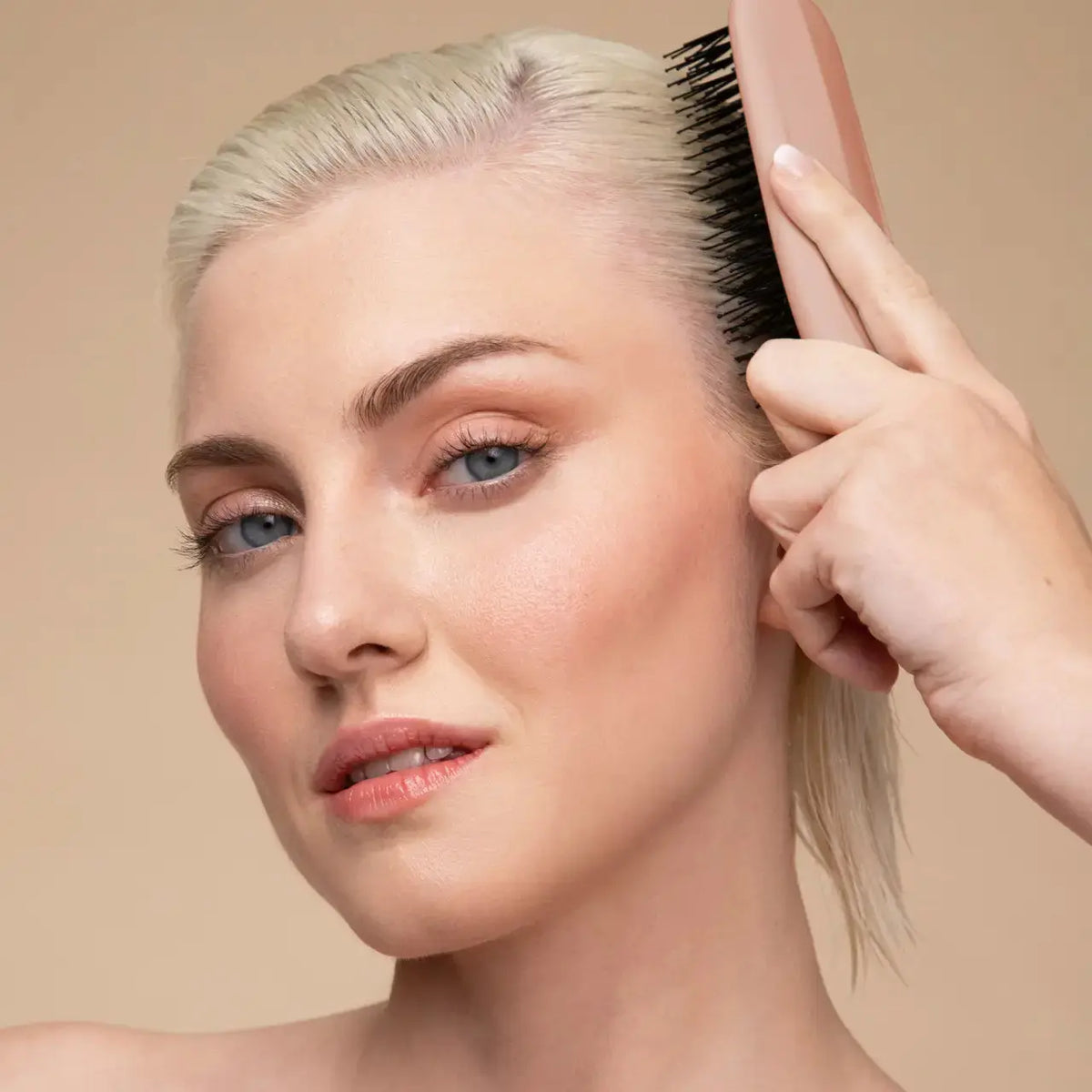 Kitsch Scalp Renewal Brush, a hair accessory with soft bristles designed for gentle scalp massage and hair care.