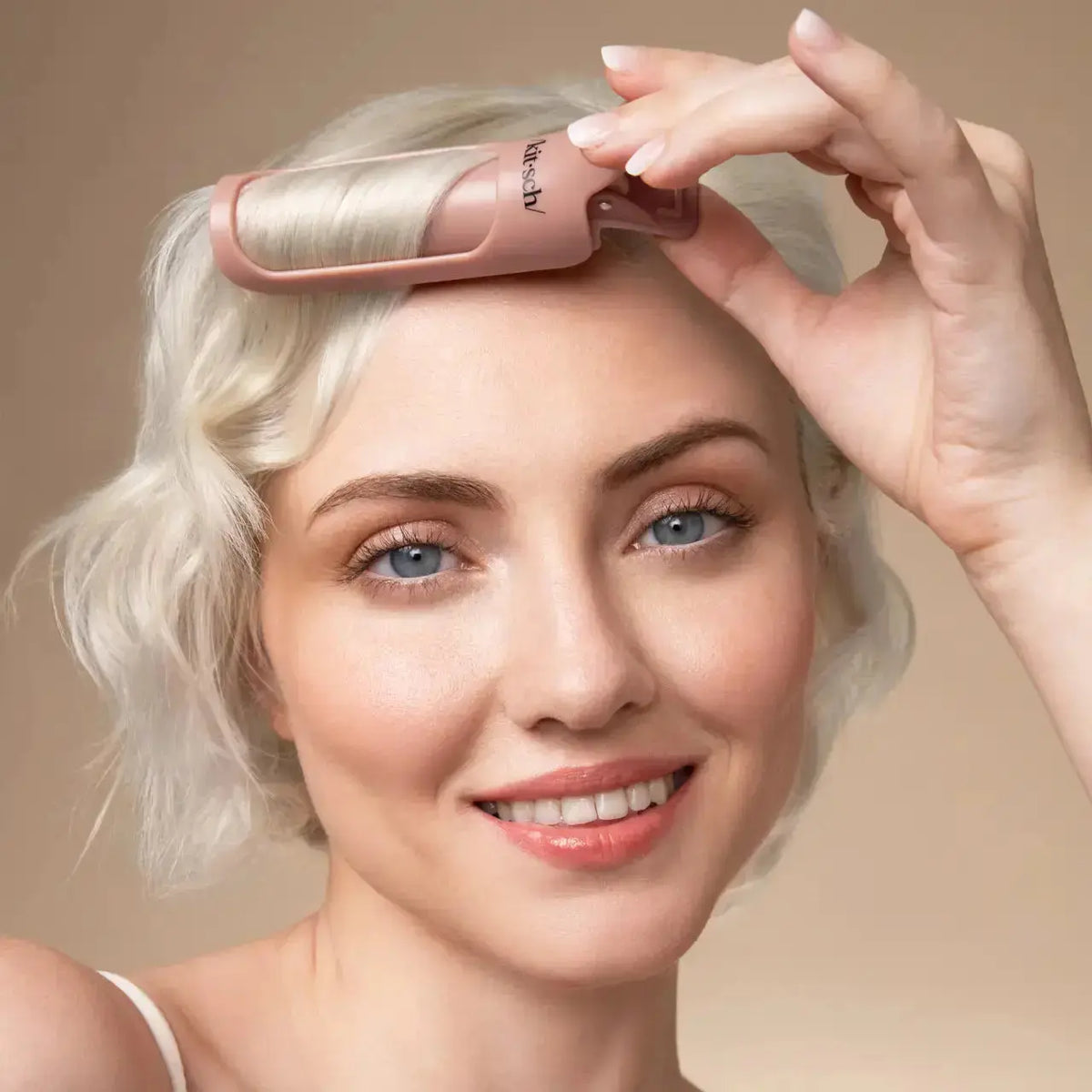 Kitsch volumizing hair clips in neutral tones, showcasing their sleek design and versatile hair accessory for added volume.