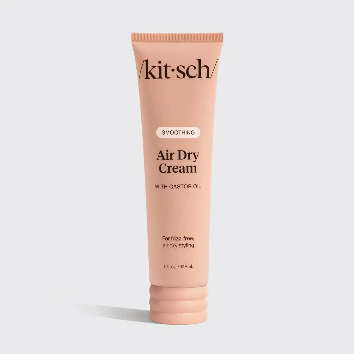 Kitsch Smooth Air Dry Cream for hair care, showing a tube of the product with a sleek design and soft packaging.