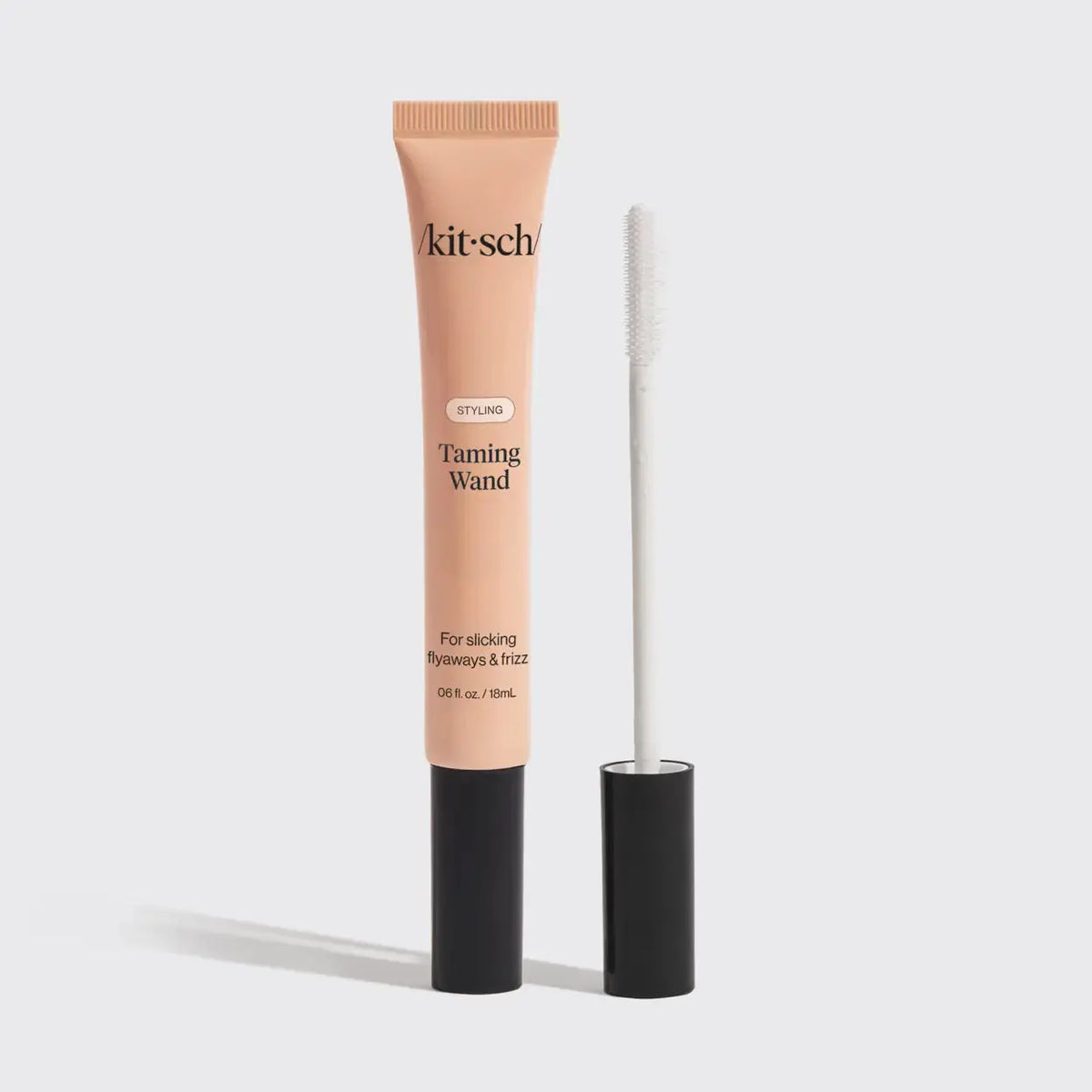 Kitsch Styling Taming Wand hair care tool with ceramic barrel for smooth, polished curls and waves.