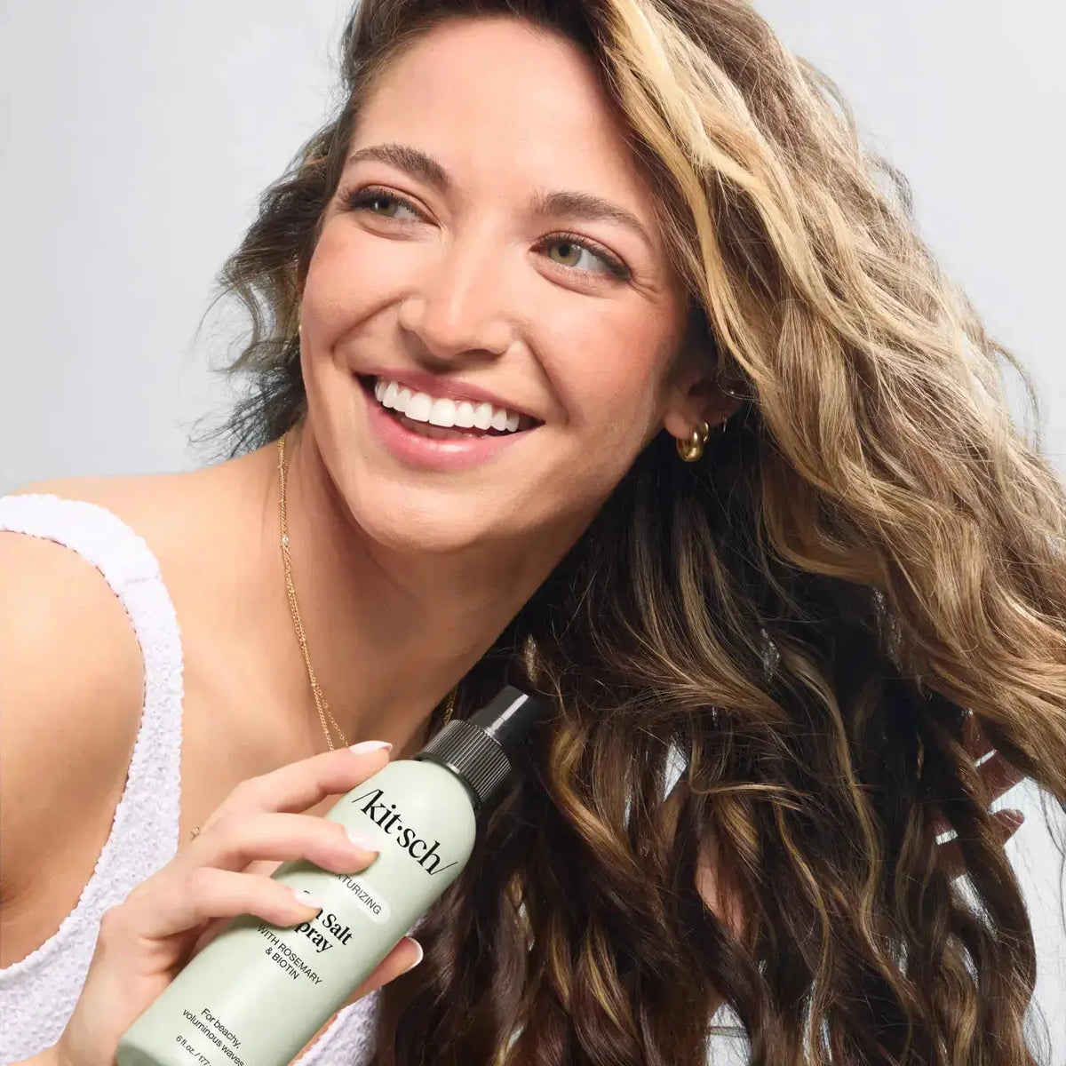 Kitsch Texturizing Sea Salt Spray for hair care, featuring a spray bottle with sea salt formula for beachy, textured hair.