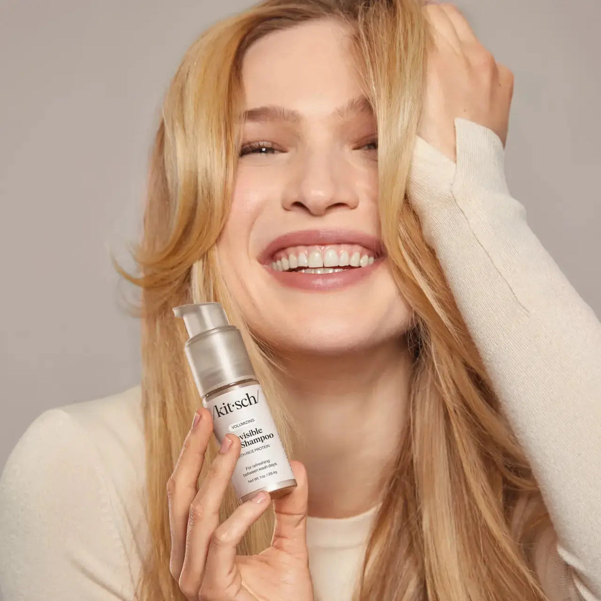 Kitsch Invisible Dry Shampoo for hair, showing a sleek bottle with a spray nozzle, ideal for refreshing hair without water.