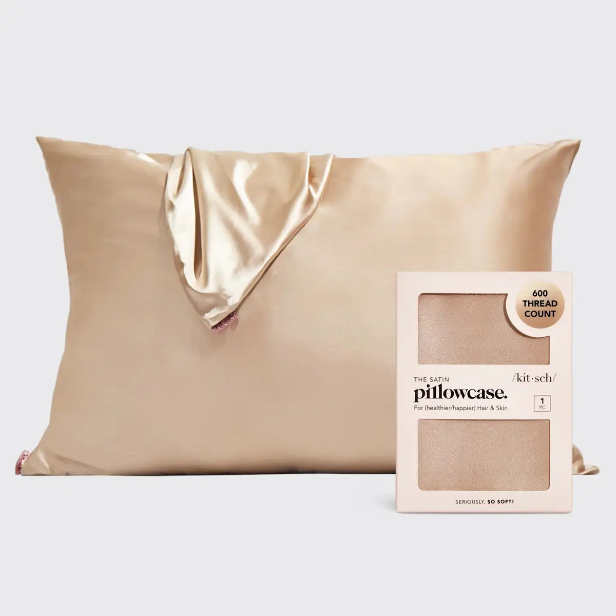Ivory satin hair pillowcase by Kitsch, showcasing smooth, shiny fabric designed to protect hair and reduce frizz during sleep.