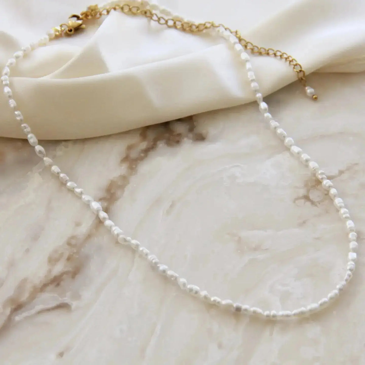 Maive Lumi Pearl Necklace featuring delicate 1.8–2mm pearls on a fine chain