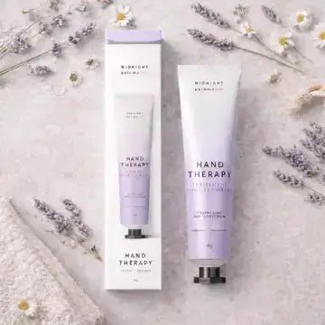 Hand therapy cream by Midnight Paloma with lavender and chamomile, featuring a soothing, creamy texture in a jar.