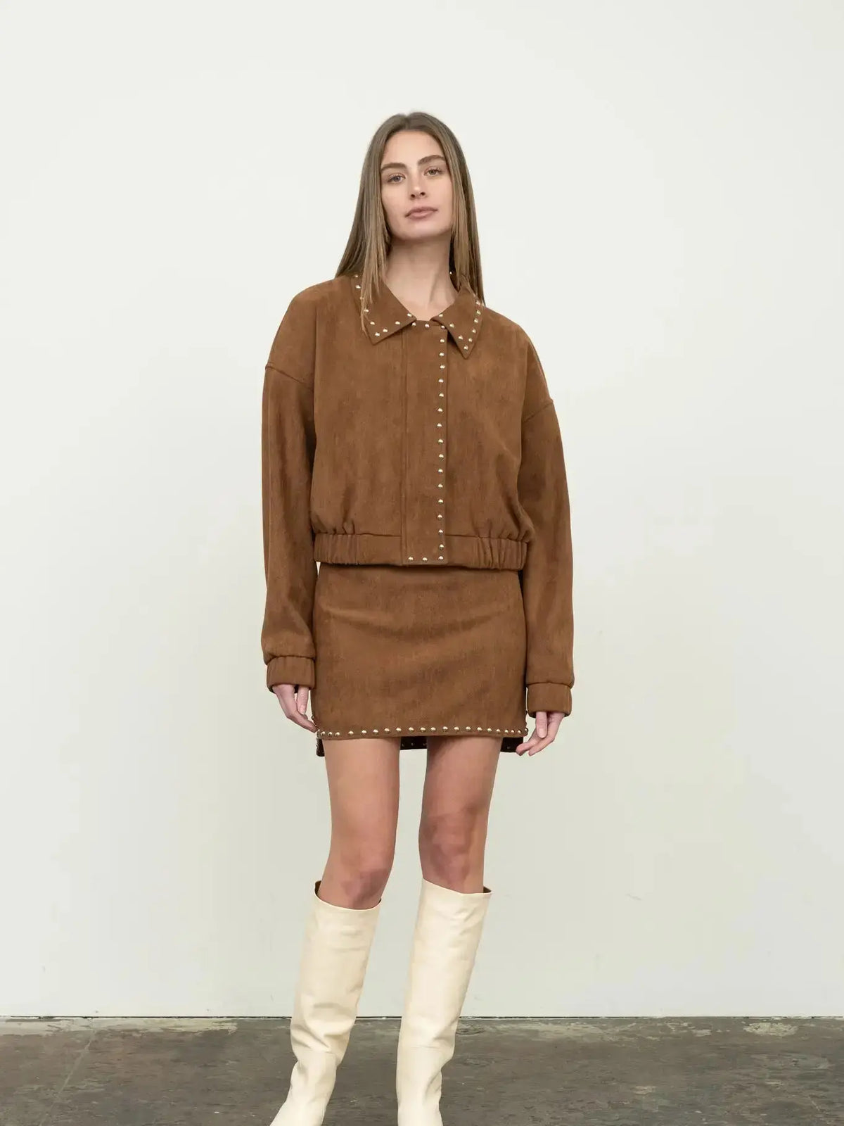 Moonriver Dakota faux suede jacket, stylish apparel with a soft suede texture, shown in a close-up image.