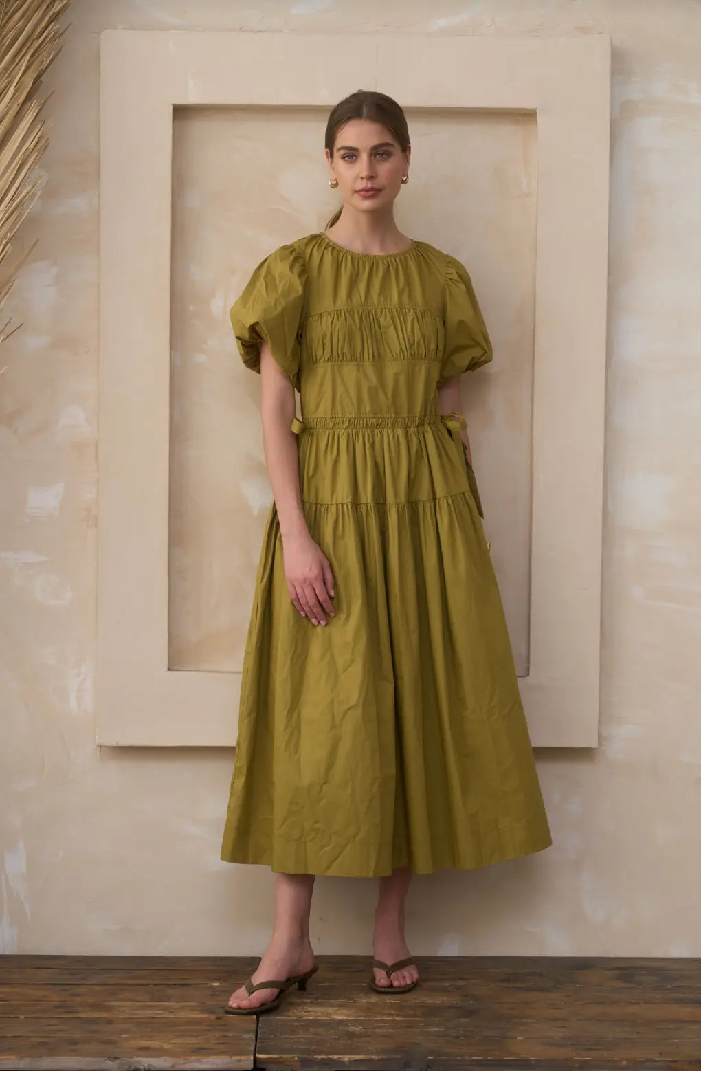 Extra small Moonriver The Lark Cotton Midi Dress displayed on a hanger, showcasing its flowing fabric and elegant design.
