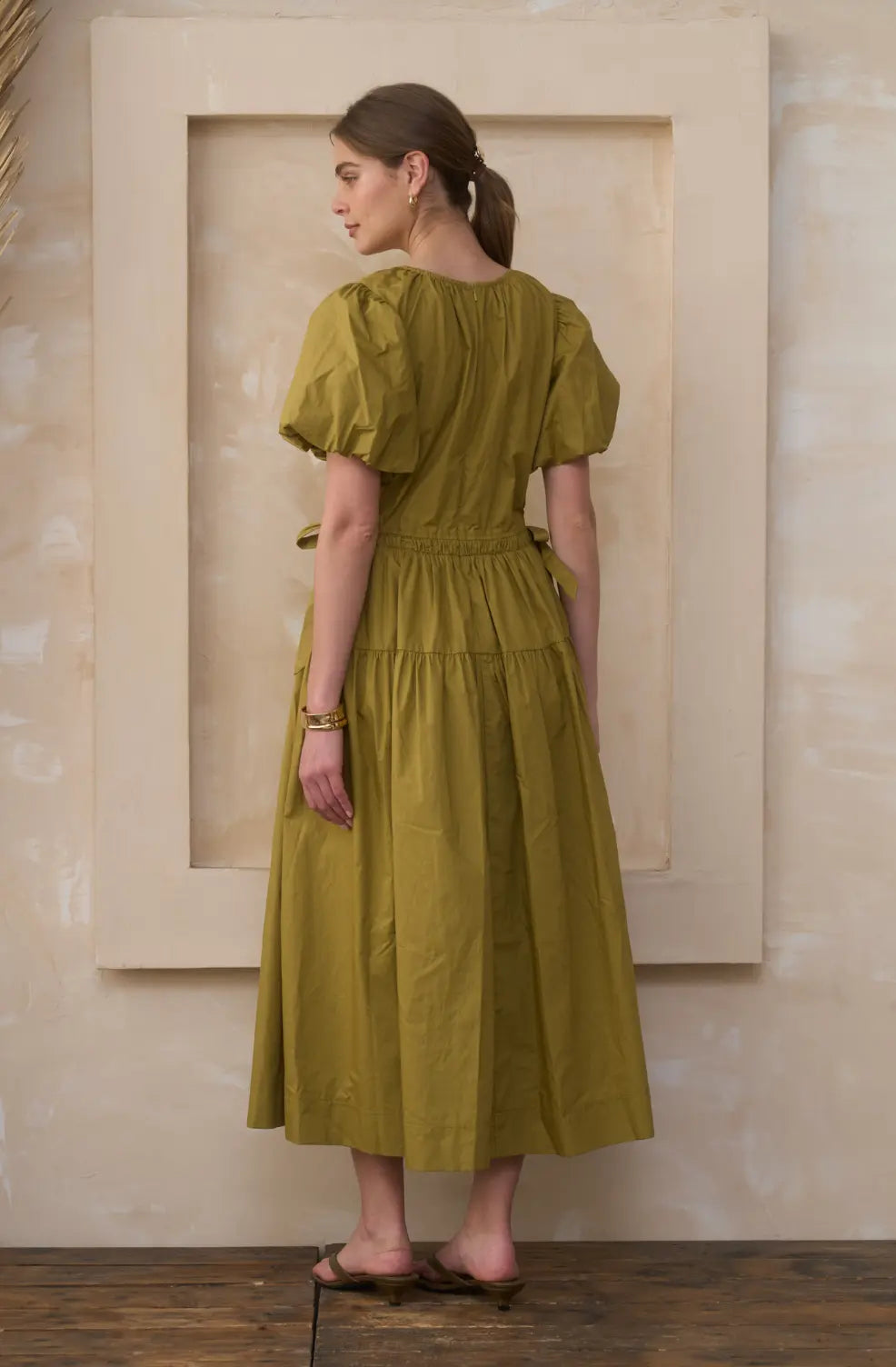 Extra small Moonriver The Lark Cotton Midi Dress displayed on a hanger, showcasing its flowing fabric and elegant design.