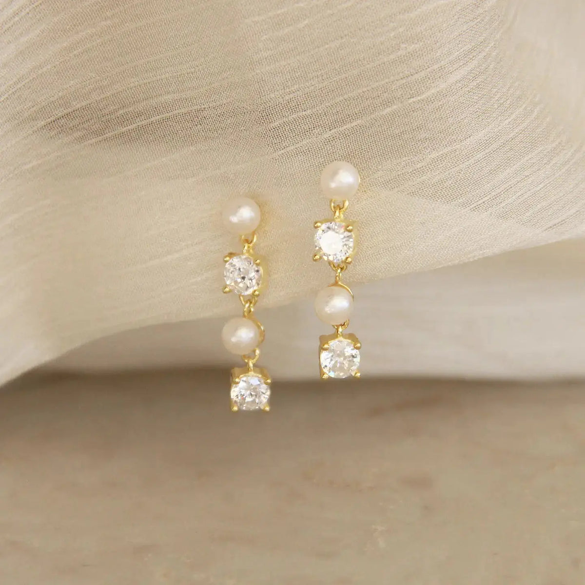 Gold-plated Ruth earrings by naive featuring sparkling cubic zirconia stones, elegant jewelry for special occasions