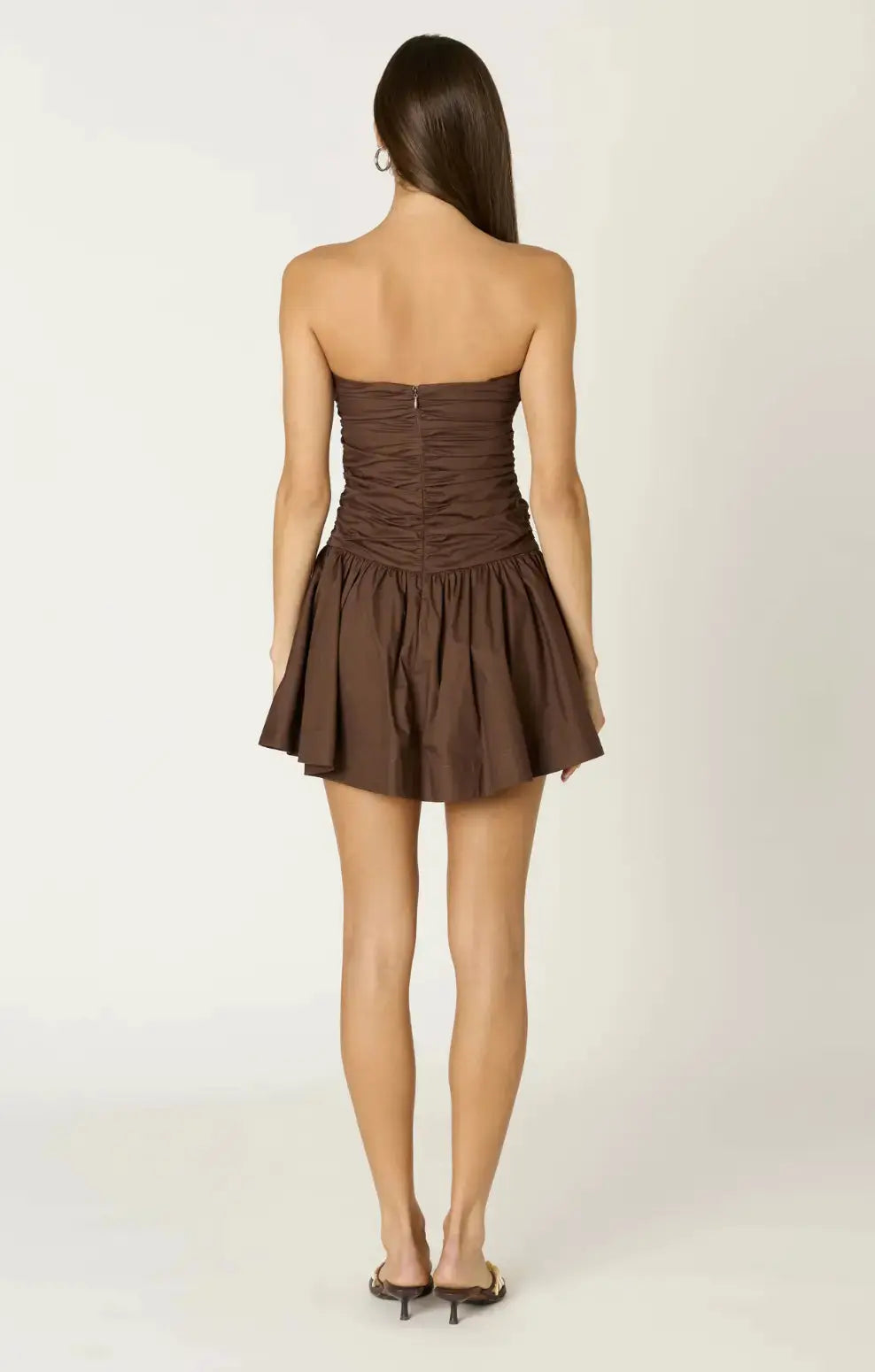 NIA The Remi Mini Dress in extra small, stylish black apparel with a fitted silhouette and sleeveless design.