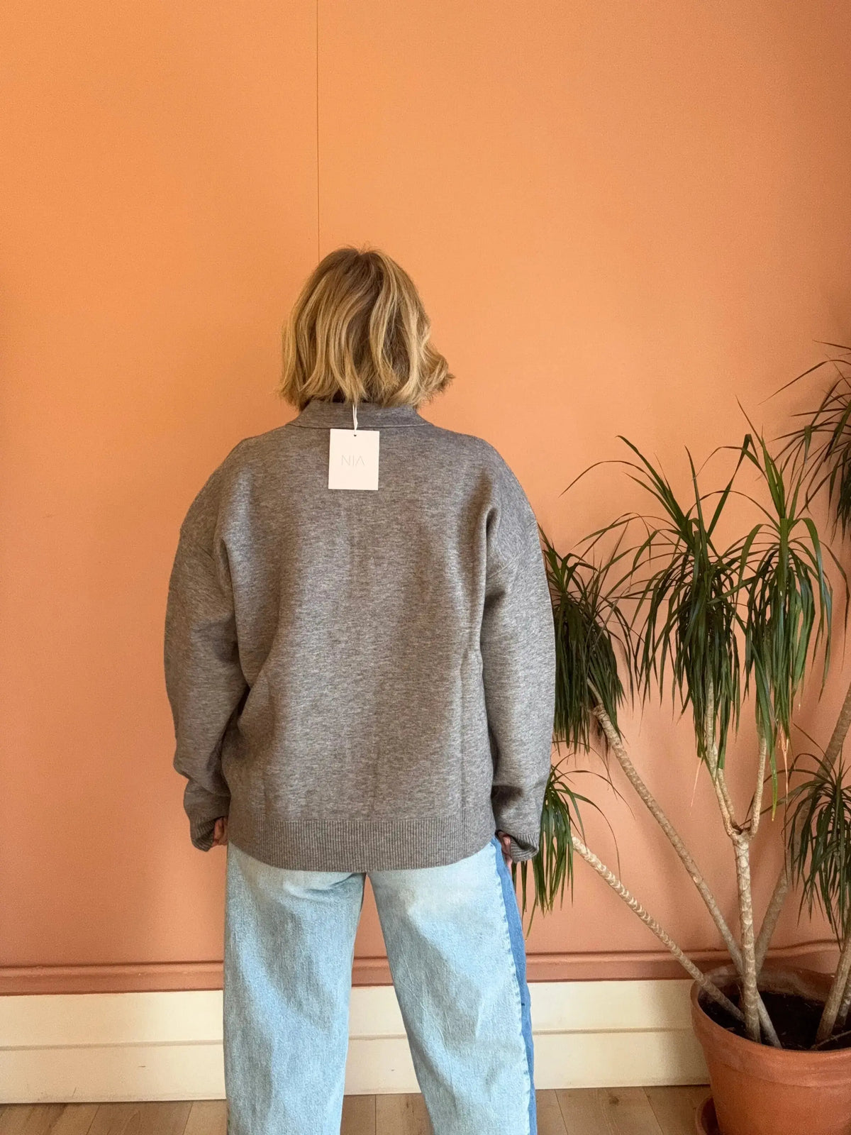 Gray Nia Marlow Sweater in cozy polo knit, featuring a fitted design and ribbed cuffs, perfect for casual wear.