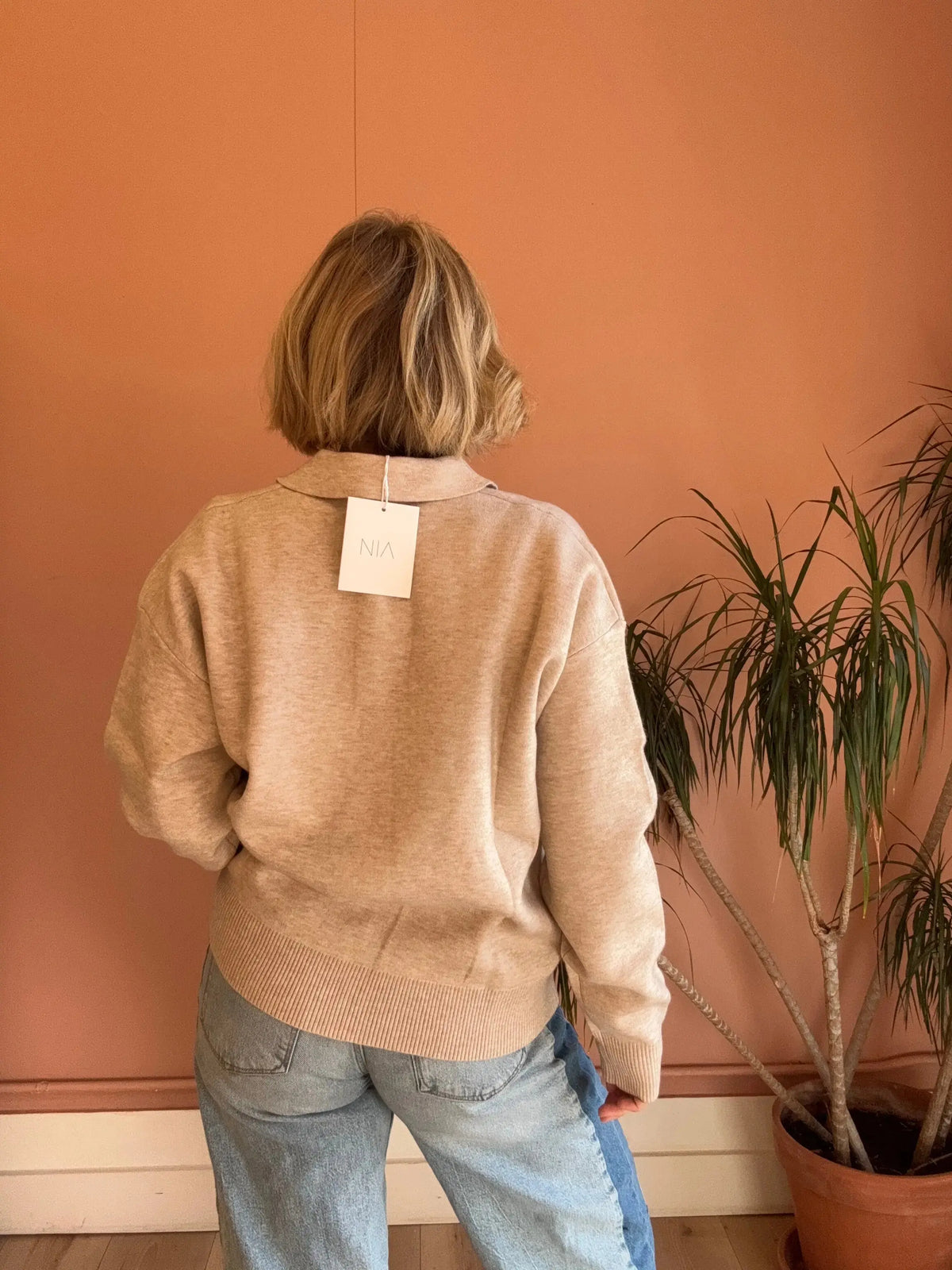 Gray Nia Marlow Sweater made of cozy polo knit fabric, displayed in an extra small size with a soft, comfortable fit.
