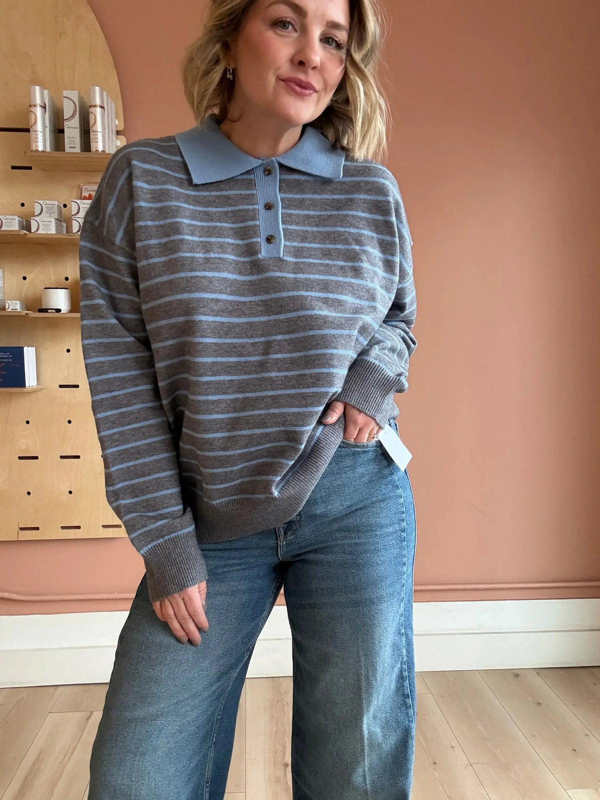 Gray Marlow Sweater by Nia, cozy polo knit apparel in extra small size, showing a close-up of the soft textured fabric.