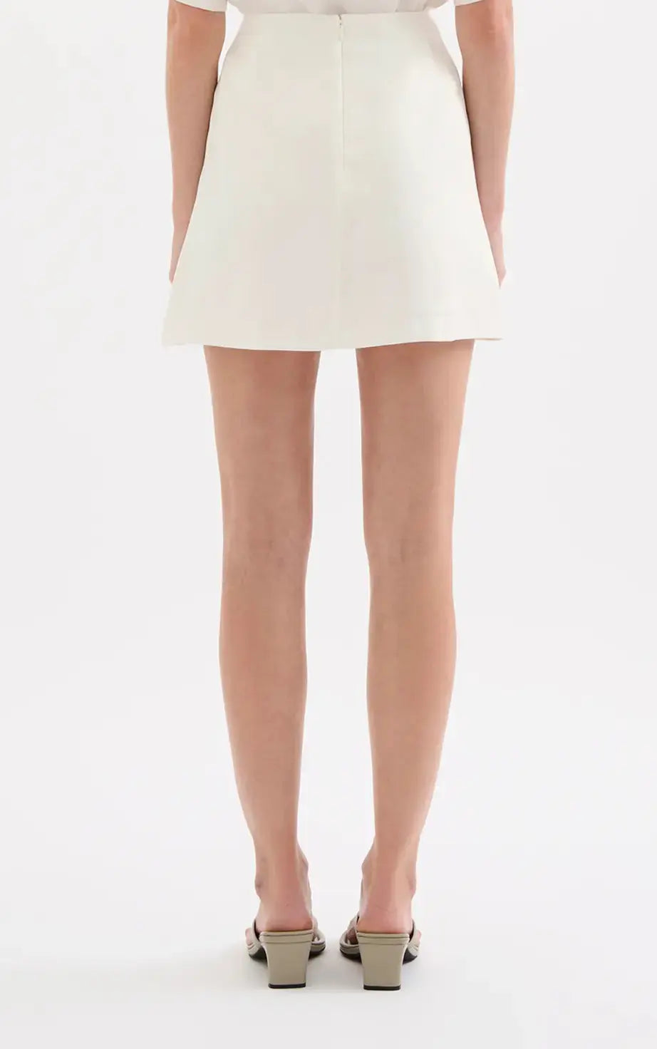 Nude Lucy Beckett Mini Skirt in extra small size, showcasing stylish apparel with a fitted silhouette and minimalist design.
