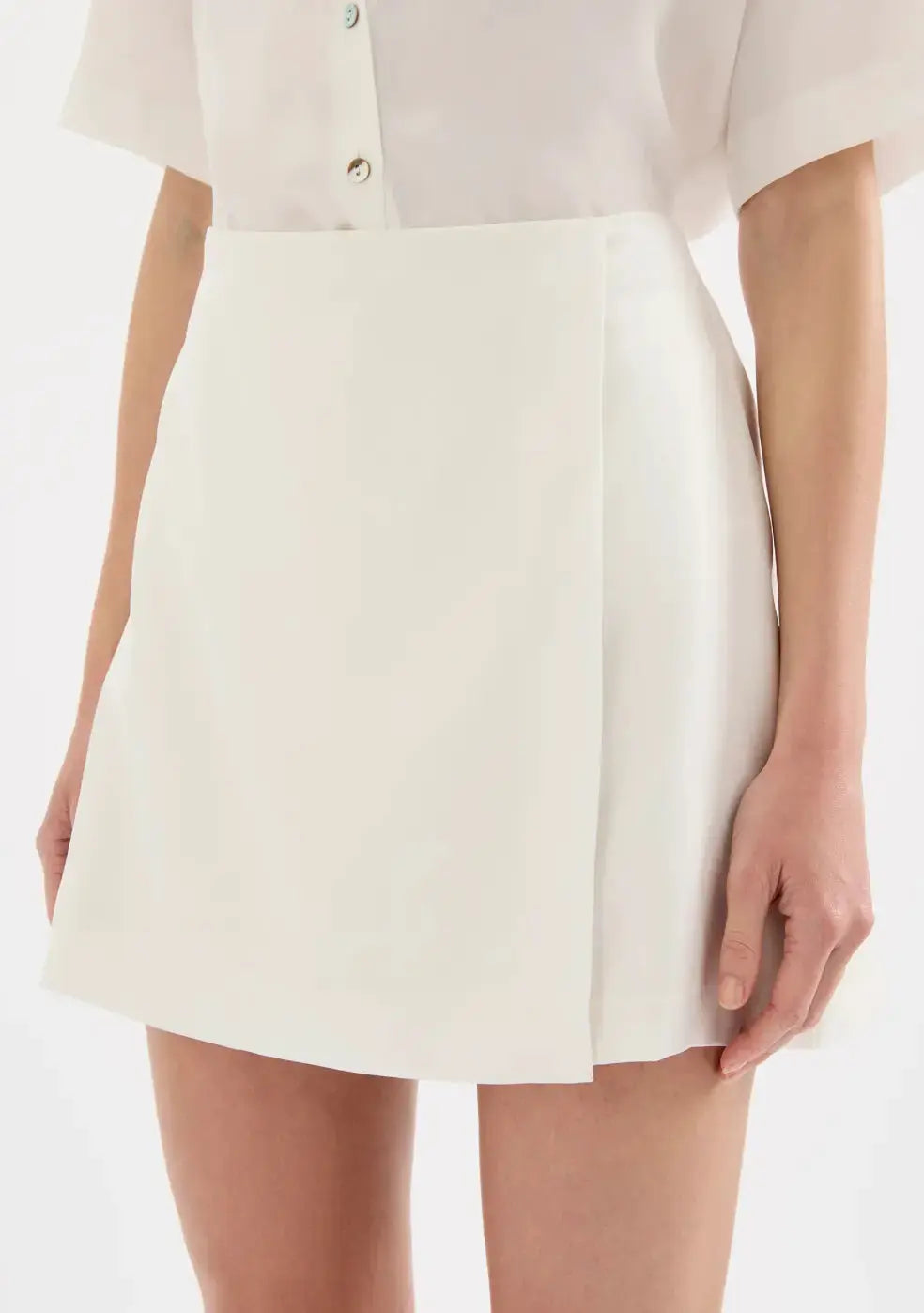Nude Lucy Beckett Mini Skirt in black, stylish women's apparel, shown on a flat lay with attention to the skirt's fit and fabric.