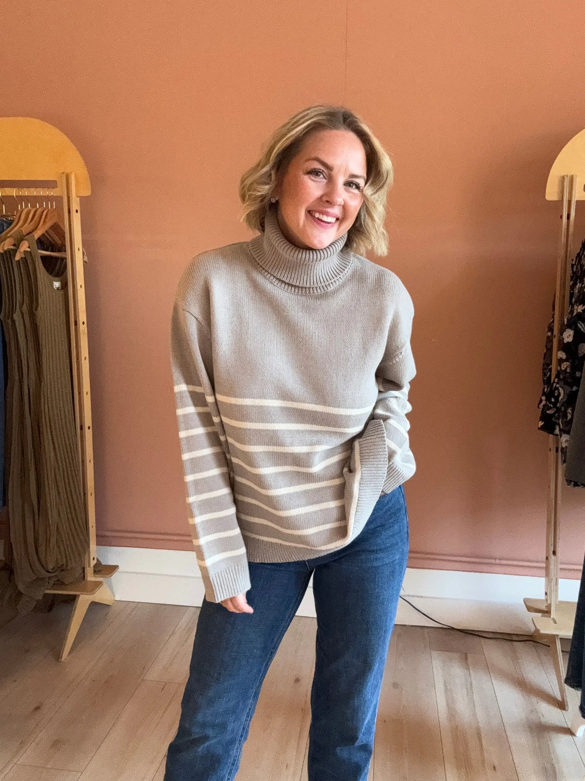 Nude Lucy Venus turtleneck sweater in extra small, soft knit fabric, featuring a classic turtleneck design and fitted silhouette.